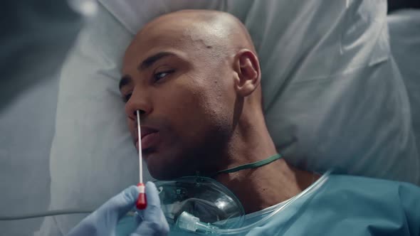 Patient Getting Swab Testing for Covid19 in Hospital Emergency Unit Closeup alt