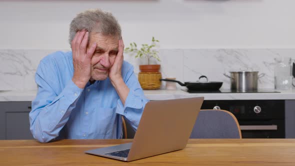 A Tired Broken Resigned Preoccupied Elderly Man Sits in Front of a ...