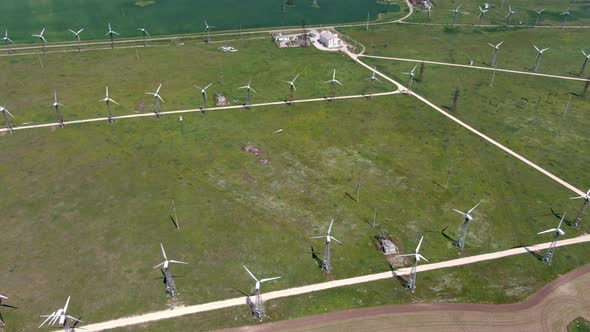 Shooting Quadrocopters Working Wind Turbines Between Fields