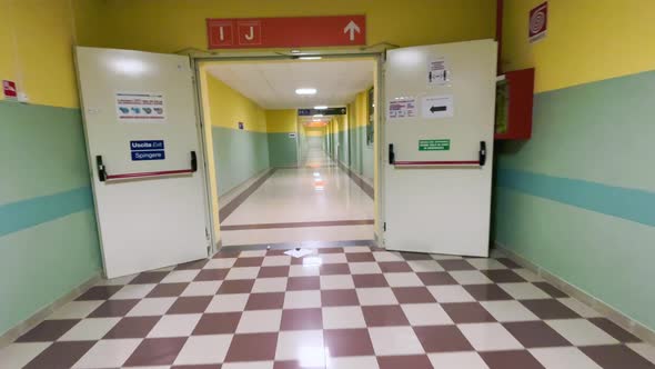 Walikng Along an Empty Corridor Inside the Hospital alt