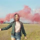 Asian Pretty Woman with Red Smoke Bomb in Nature - VideoHive Item for Sale