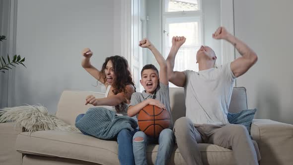 Young Family On The Sofa In The Room alt