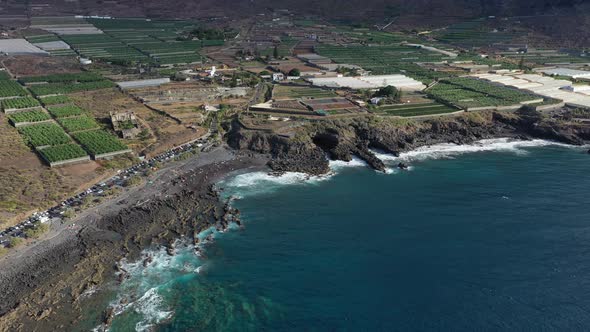 Tenerife, a view of banana plantations, a black beach of volcanic sand on the Atlantic ocean alt