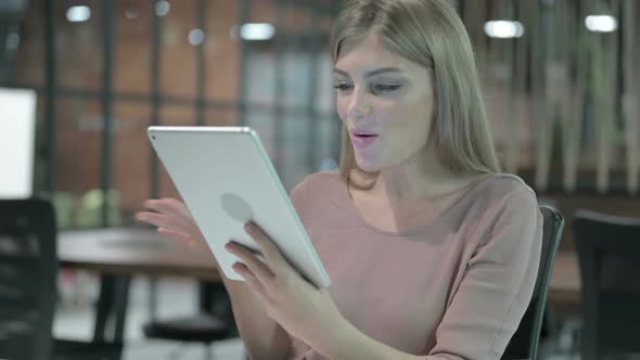 Portrait Shoot of Beautiful Woman Doing Video Chat on Tablet alt