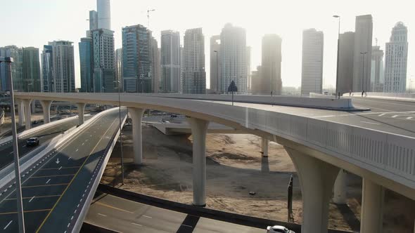 Dubai City with Its Many Skyscrapers and a Big Multi Level Intersection alt