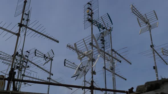 antennas installed on the roof of building moved by the wind alt