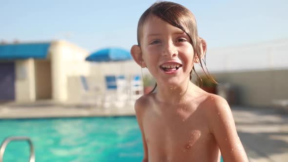 A Young Boy At The Pool