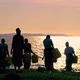 Women Fill Water From the Lake at Sunset - VideoHive Item for Sale