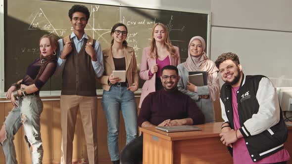 Portrait Of Cheerful Students and Maths Professor at Blackboard alt
