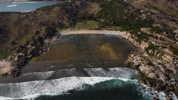 Aerial top down shot showing bay of Hy sea near Binh Hung Island in Vietnam alt