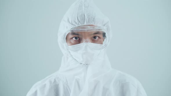 Doctor / Scientist waring PPE suit to protect virus in Covid-19 Corona virus (SARS-CoV-2) pandemic.