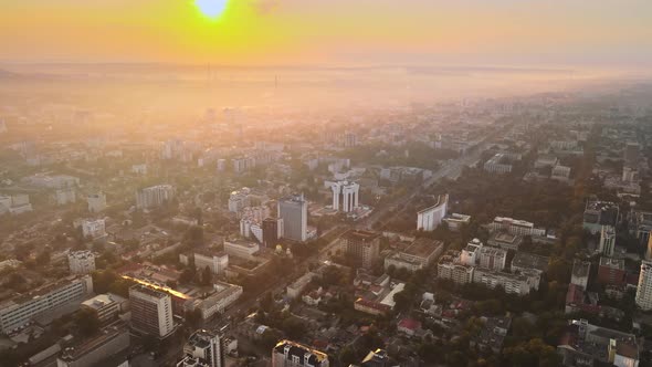 Aerial drone view of Chisinau at sunrise. Panorama view of multiple buildings, roads. Moldova alt