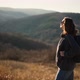A Young Adult Woman Enjoying Fresh Air and View From the Hill While Trekking - VideoHive Item for Sale