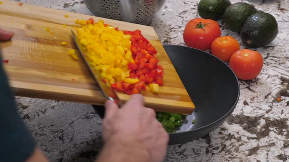 Green Red And Yellow Peppers Diced And Put In Bowl 01