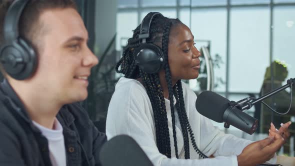 Confident African American Woman With White Man Hosting on Radio Show alt