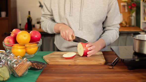 Woman Cutting Red Aplles Closeup alt