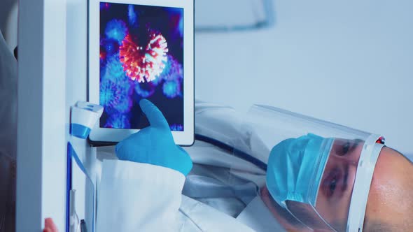 Vertical Video: Doctor Explaining Evolution of Virus alt