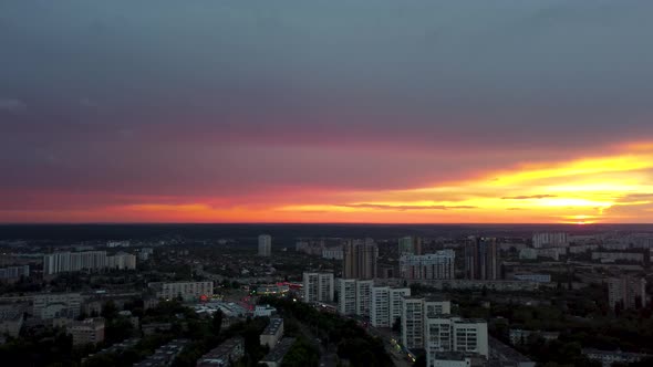 Aerial sunset in city. Streets cityscape at dusk