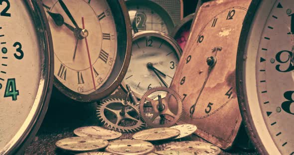 Retro watchmakers workshop with spare parts and broken clocks alt