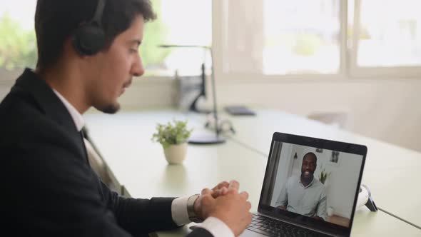 Business Partners Talking on the Distance Latin Businessman Using Laptop for Video Connection