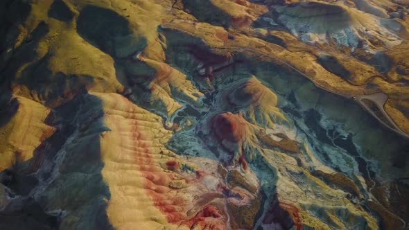 Aerial view of Painted Hills rock formation during the sunset, Oregon, U.S.A. alt