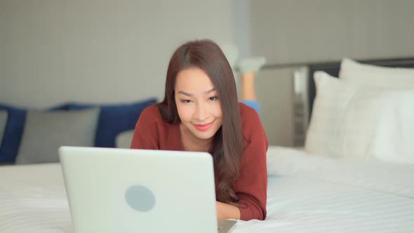Young asian woman use laptop alt