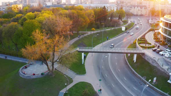 People Walk in the Park During a Beautiful Sunset. Aerial alt