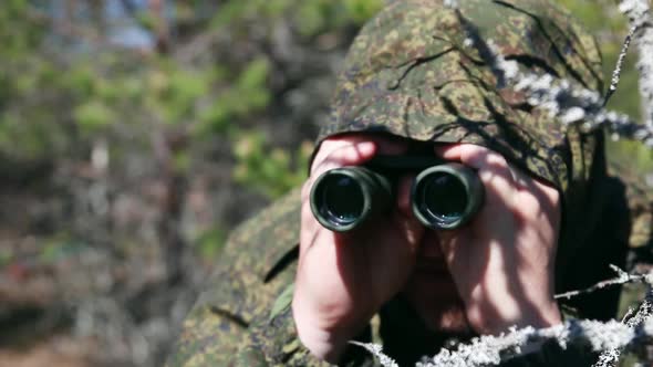 Saboteur or Scout Watches Through Binoculars