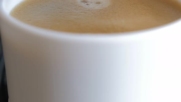 Fresh made coffee cream and drops from coffee machine 4K 2160p UHD footage - Coffee cup full of tast alt