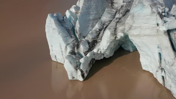 Birds Eye View of Majestic Iceberg Floating Breidamerkurjokull Glacier Tongue in Iceland alt
