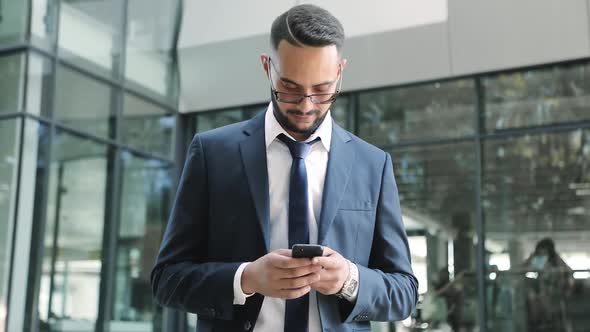 Successful Young Businessman Standing Outdoor.