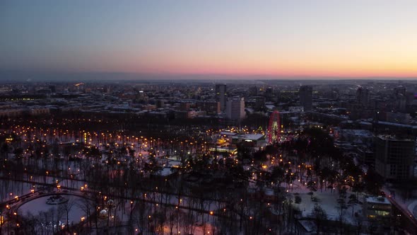 Aerial city amusement Gorky Central Park in sunset