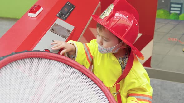 Little Girl In A Firefighter Uniform In Gyeonggi Children's Museum, South Korea - medium shot alt