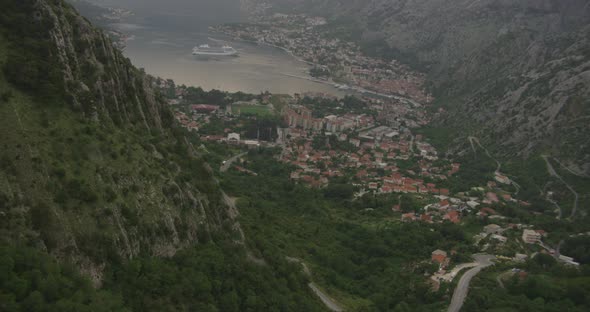 Helicopter aerial shot moving steadily toward jet plane over ocean, foggy day alt