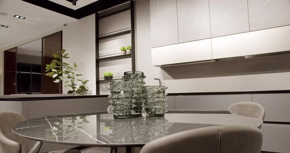 Modern gray and white kitchen furniture with marble table. Modern Minimalist Home alt
