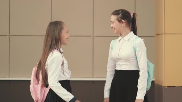 Ay Hello with Your Elbows. Schoolgirls Go To School. Girls School Girls Greet Each Other with Their alt