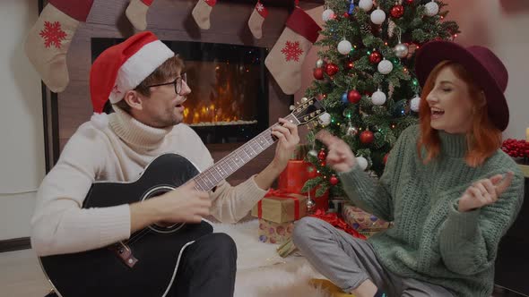 Young happy active family couple singing laughing together alt