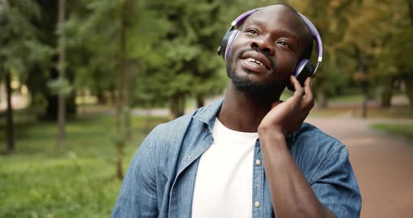 Afro-american Male in Headphones Singing