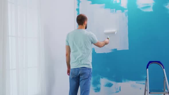 Covering Wall Blue Paint alt