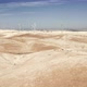 Aerial Shooting of a Wind Power Farm From Afar - VideoHive Item for Sale