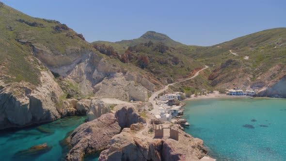Flying Towards a Bay Surrounded by Cliffs on the Aegean Sea in Cyclades Milos alt