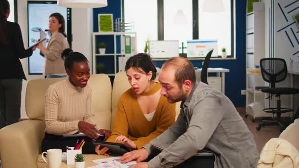 Diverse Team of Successful Young Entrepreneurs Sharing Highfive Celebrating Success alt