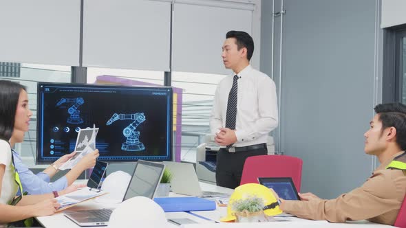 Young businesspeople group have discussion meeting about robot technology in office workplace. alt