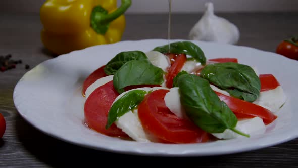 Caprese Salad With Pouring Olive Oil 04