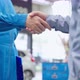 Asian automotive mechanic repairman handshake with client in garage. - VideoHive Item for Sale