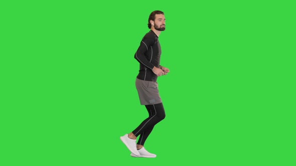 Runner Man In Sportswear Exercising Jogging on a Green Screen Chroma Key