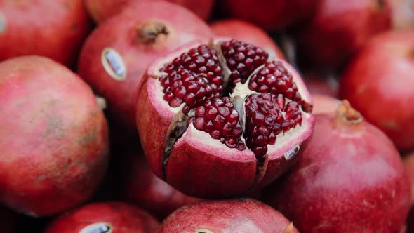 Close up view of pomegranate fruits that are selling on turkish market stall alt