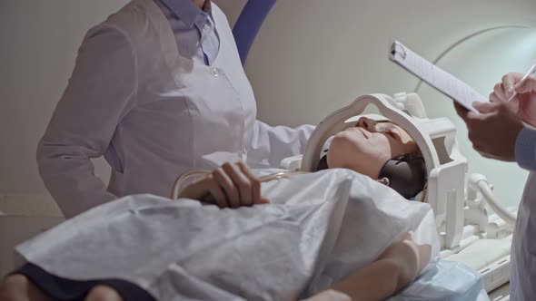 Radiologists Performing Scan on MRI Machine alt