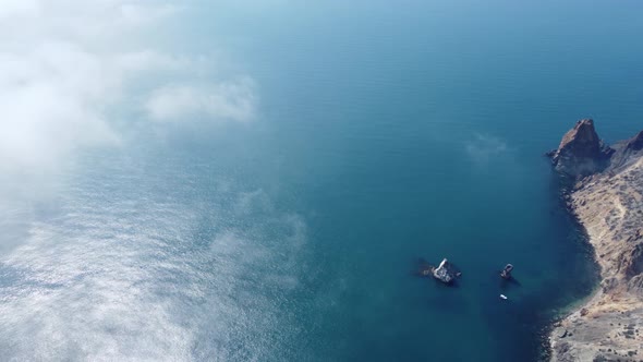 High Above the Thick Fog Like Beautiful Ocean of Clouds at Sunrise alt