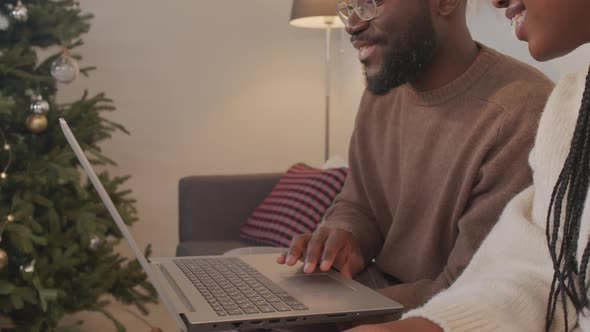 African-American Couple Using Laptop in Christmas alt